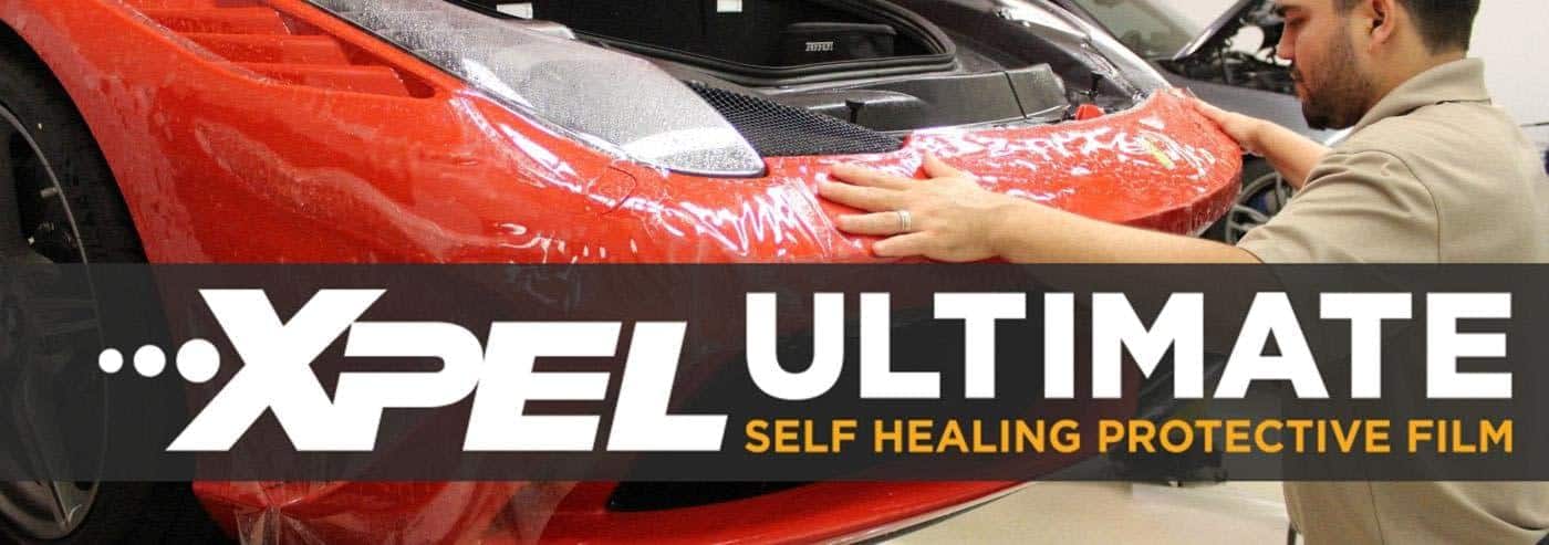 XPEL Ultimate Plus Car Paint Protection Film getting installed on Ferrari front end.